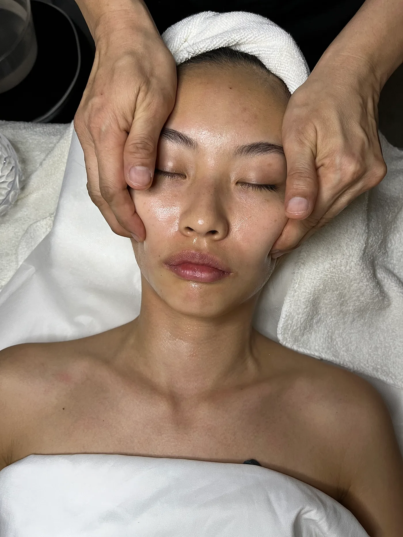 Lifting facial massage in progress